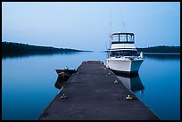 Dock with motorboat and yacht at dusk, Moskey Basin. Isle Royale National Park ( color)