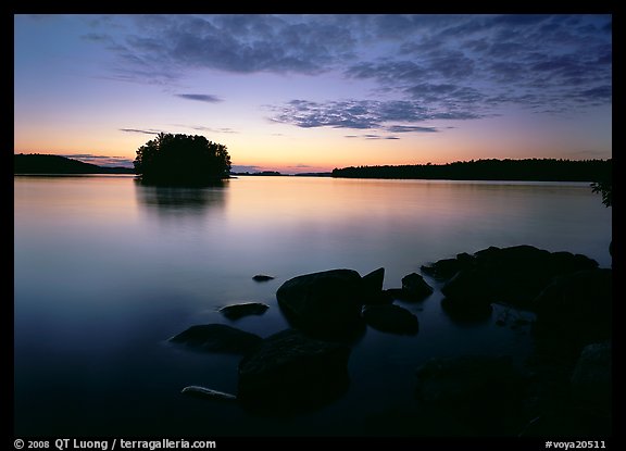 Kabetogama lake sunset with eroded granite and tree-covered islet. Voyageurs National Park, Minnesota, USA.