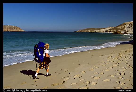 Backpacker on beach, Cuyler harbor, San Miguel Island. Channel Islands National Park, California, USA.