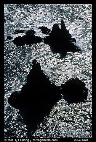 Backlit rocks and water, Cathedral Cove, Anacapa, late afternoon. Channel Islands National Park, California, USA.