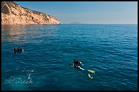 Scuba divers on ocean surface, Santa Cruz Island. Channel Islands National Park, California, USA.