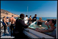 Divers in hot tub aboard the Spectre dive boat, Santa Cruz Island. Channel Islands National Park, California, USA.