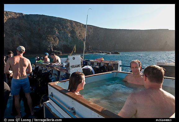 Divers relaxing in hot tub aboard the Spectre and Annacapa Island. Channel Islands National Park, California, USA.