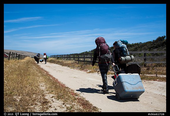 Campers haul gear, Santa Rosa Island. Channel Islands National Park, California, USA.