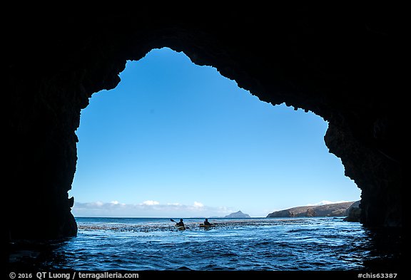 Looking out sea cave entrance with distant sea kayakers, Santa Cruz Island. Channel Islands National Park (color)