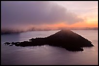 Cloud above Wizard Island at dawn. Crater Lake National Park, Oregon, USA.