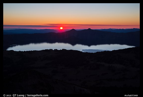 Wide view from Mount Scott of sun setting over Crater Lake. Crater Lake National Park (color)