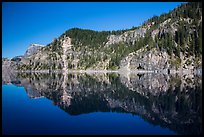 Cliffs reflected in calm waters. Crater Lake National Park ( color)