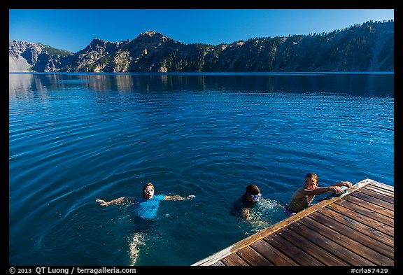 Girls swim from Wizard Island dock. Crater Lake National Park (color)