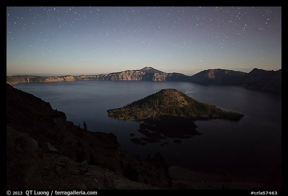 Wizard Island and lake with moonlight. Crater Lake National Park, Oregon, USA.