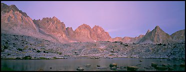 Pink light on High Sierra and lake at twilight. Kings Canyon National Park (Panoramic color)