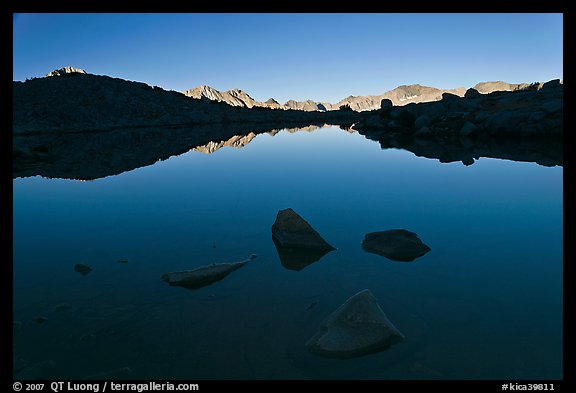 Rocks and calm lake with reflections, early morning, Dusy Basin. Kings Canyon National Park (color)