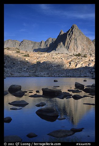 Isoceles Peak reflected in a lake in Dusy Basin, late afternoon. Kings Canyon National Park, California, USA.