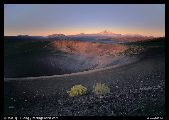 Sagebrush bushes, Cinder cone rim, and Lassen Peak, sunrise. Lassen Volcanic National Park, California, USA.