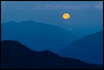 Moon setting over ridges, North Cascades National Park. Washington, USA.