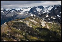 Cloud-capped mountains in dabbled light, North Cascades National Park.  ( color)