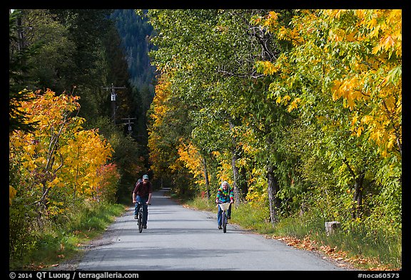 Bicyclists in autumn, Stehekin, North Cascades National Park Service Complex.  (color)