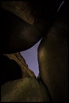 Night sky seen through opening between boulders. Pinnacles National Park, California, USA.
