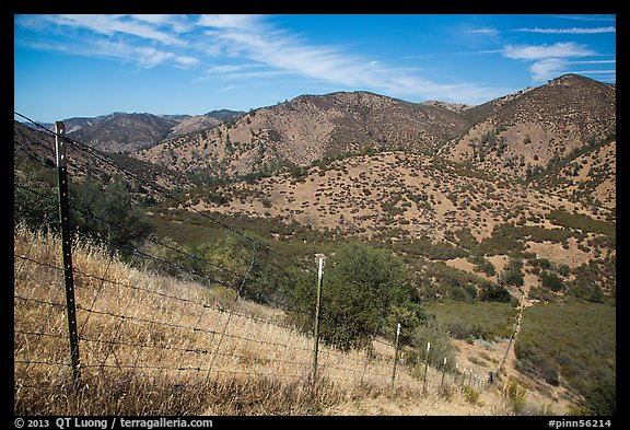 Boundary fence along steep hill. Pinnacles National Park, California, USA.