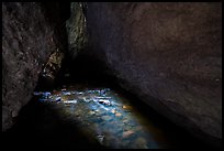 Light on stream in dark cave. Pinnacles National Park ( color)