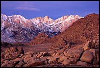 Volcanic boulders in Alabama hills and Mt Whitney, dawn. Sequoia National Park, California, USA.