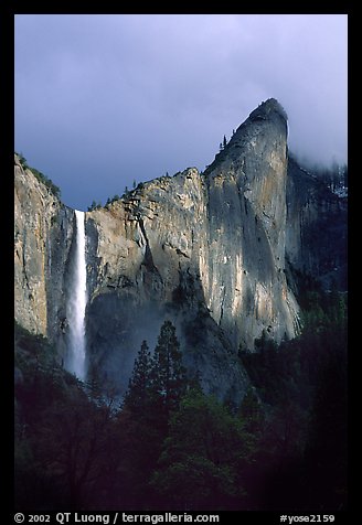 Bridalveil Falls and Leaning Tower, stormy sky. Yosemite National Park, California, USA.