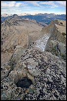 Frozen pot hole and summit cliffs, Mount Hoffman. Yosemite National Park, California, USA. (color)