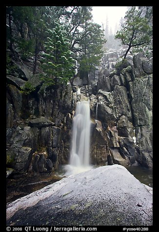 Snow-covered boulder and base of Chilnualna Falls. Yosemite National Park (color)