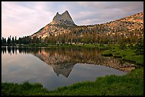 Cathedral Peak reflected in upper Cathedral Lake, late afternoon. Yosemite National Park, California, USA.