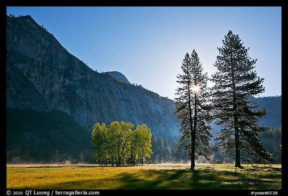 Sun and Ahwanhee Meadows in spring. Yosemite National Park, California, USA.