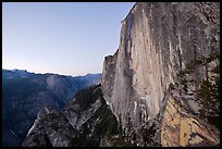 Hiker, Half-Dome and Tenaya Canyon from the Diving Board at dusk. Yosemite National Park, California, USA.