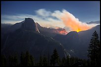 Half-Dome and wildfire at night. Yosemite National Park, California, USA.