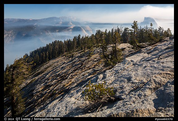 Smoke-filled valley and Half-Dome from Sentinel Dome. Yosemite National Park, California, USA.