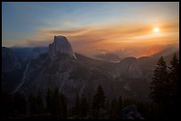 Half-Dome, wildfire, and moon. Yosemite National Park, California, USA.