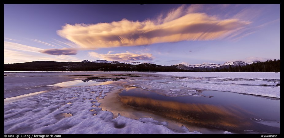 Snow-covered Twolumne Meadows and big cloud at sunset. Yosemite National Park, California, USA.