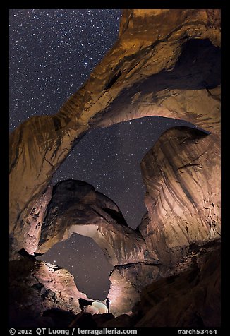 Visitor lighting up Double Arch at night. Arches National Park (color)