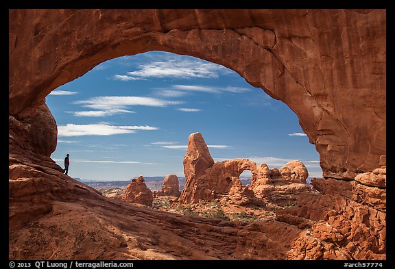 Park visitor looking, Turret Arch framed by North Window. Arches National Park (color)