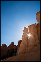 Sun star between hoodoos. Bryce Canyon National Park ( color)