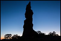 Standing Rock silhouette at sunrise. Canyonlands National Park, Utah, USA. (color)