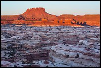 Chocolate drops, Maze canyons, and Elaterite Butte at sunrise. Canyonlands National Park, Utah, USA.