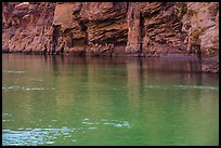 Redwall limestone reflected in green waters, Colorado River. Grand Canyon National Park, Arizona, USA.