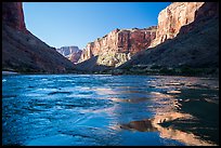 Cliffs reflected in Colorado River rapids, morning. Grand Canyon National Park, Arizona, USA.