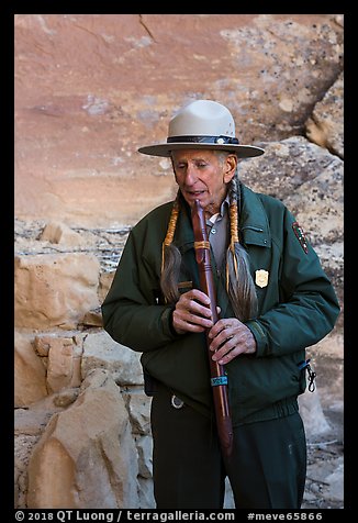Native American Ranger plays flute to honor ancestors. Mesa Verde National Park, Colorado, USA.