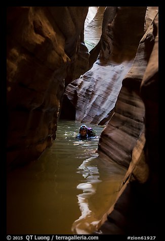 Canyoneer in dark flooded Pine Creek Canyon. Zion National Park (color)