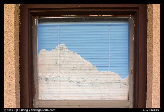 Butte, Window reflexion, Badlands National Park Headquarters. Badlands National Park, South Dakota, USA.
