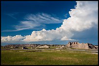 Afternoon clouds above buttes and prairie, South Unit. Badlands National Park, South Dakota, USA. (color)
