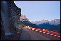 Roadside waterfall and light trail, Going-to-the-Sun road. Glacier National Park, Montana, USA.