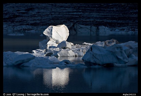 Last light on an iceberg in Upper Grinnell Lake. Glacier National Park, Montana, USA.