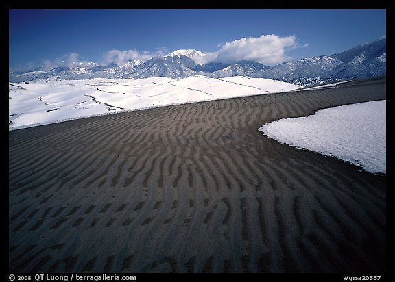 Ripples in partly snow-covered sand dunes. Great Sand Dunes National Park and Preserve, Colorado, USA.