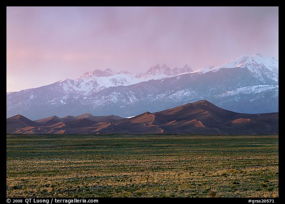 Flats, sand dunes, and snowy Sangre de Christo mountains. Great Sand Dunes National Park, Colorado, USA.